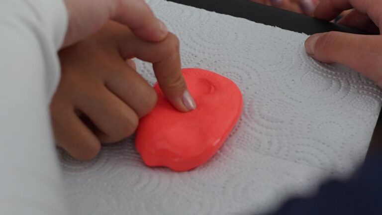 Children using colourful clay during a sensory and fine-motor activity