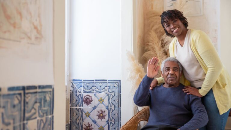 Adult daughter sharing a relaxed conversation with her older father
