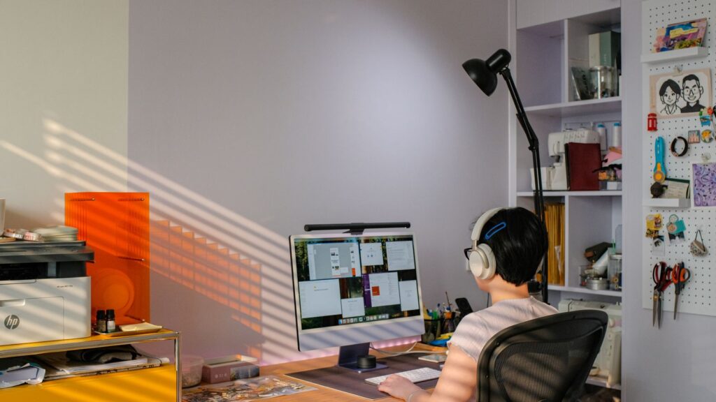 Remote worker using a desktop computer at an organised home workstation