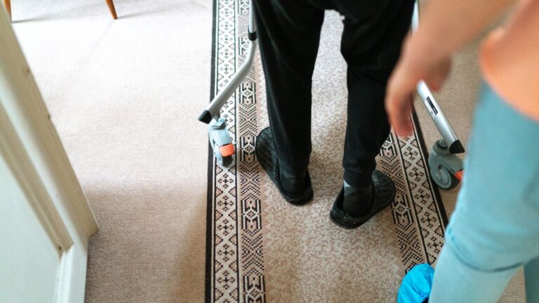 Older adult practising safe mobility with a walker at home